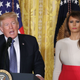 President Donald Trump is flanked by first lady Melania Trump as he speaks to guests gathered in the East Room of the White House in Washington, D.C., to celebrate Hispanic Heritage Month on Oct. 6, 2017. (Mark Wilson/Getty Images)